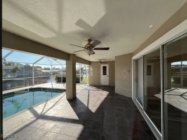 a view of a swimming pool with a chair and tables