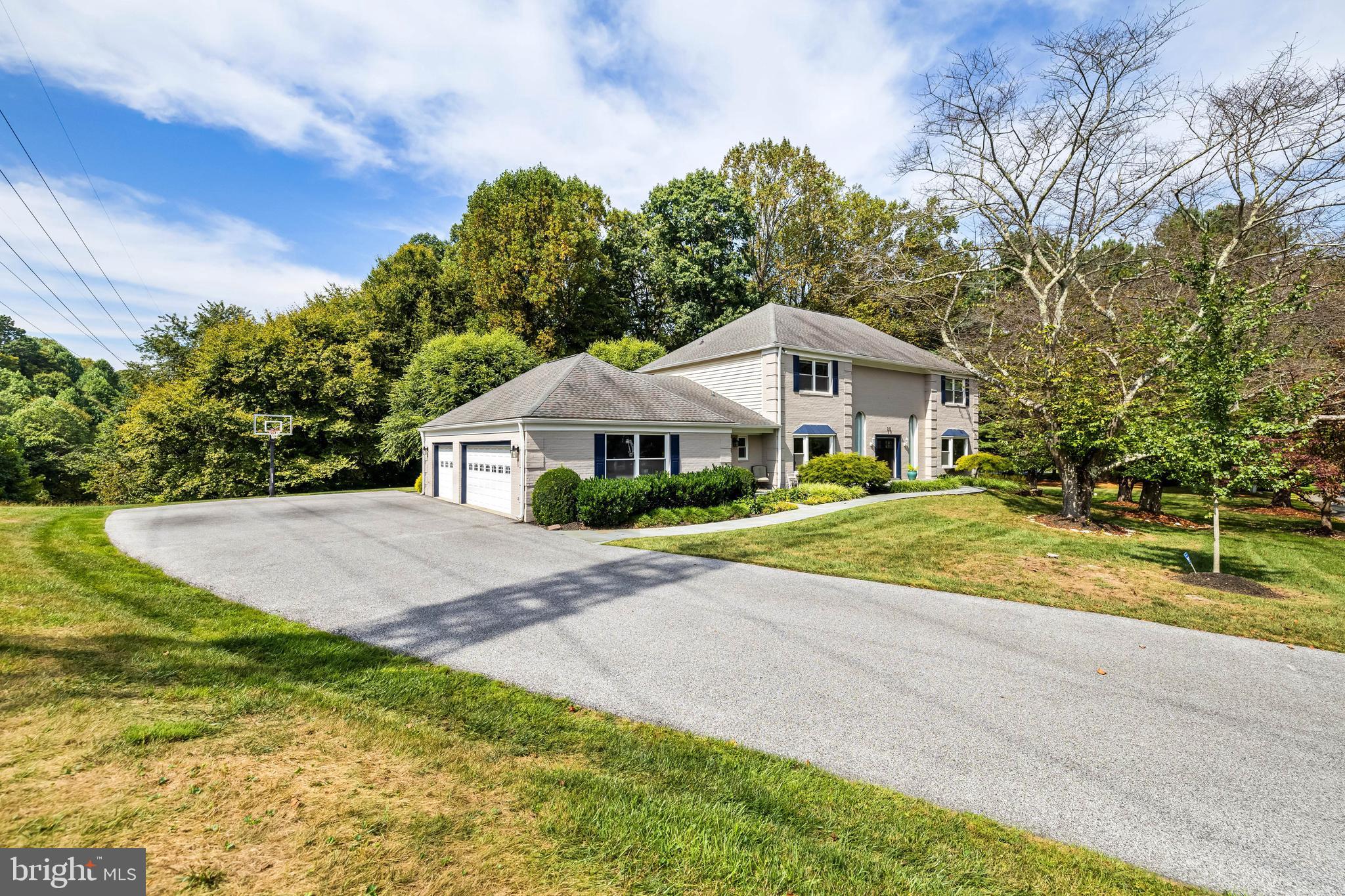 20 Highfield Court Cockeysville, MD 21030 - Photo 1 of 60 a front view of a house with a yard and trees
