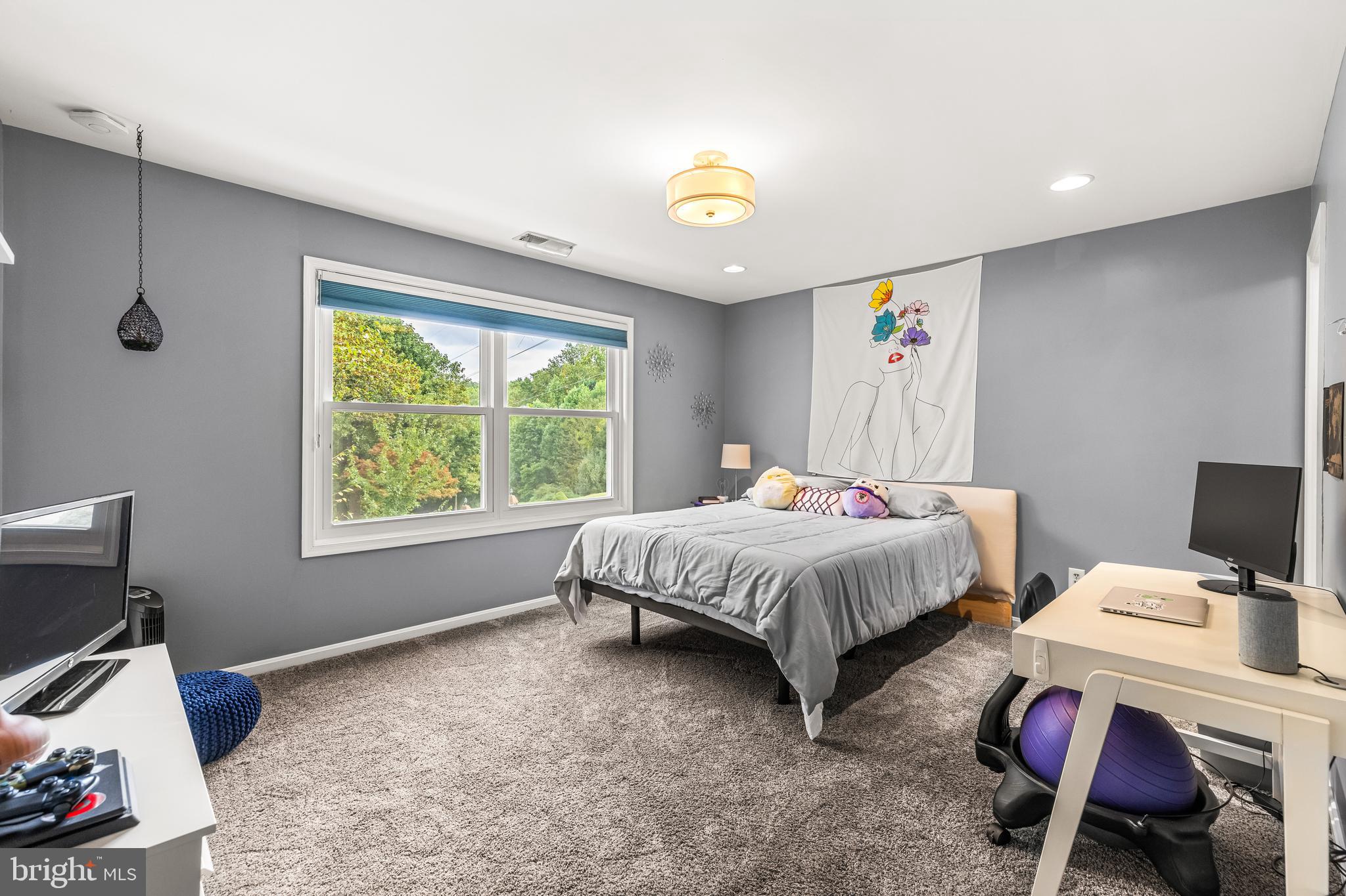 20 Highfield Court Cockeysville, MD 21030 - Photo 34 of 60 a spacious bedroom with a bed and a desk