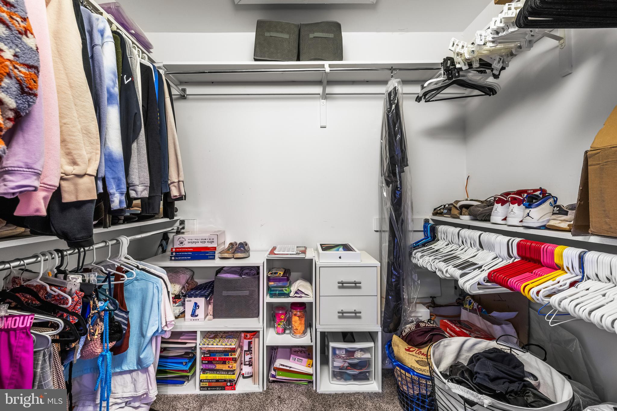 20 Highfield Court Cockeysville, MD 21030 - Photo 37 of 60 a view of walk in closet with clothes and shoes