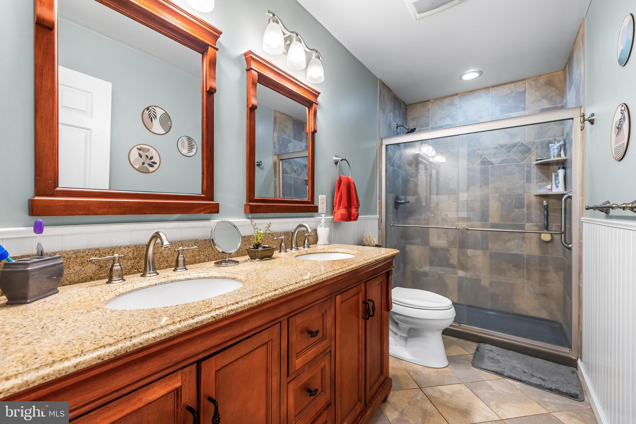 20 Highfield Court Cockeysville, MD 21030 - Photo 39 of 60 a bathroom with a granite countertop sink toilet and shower