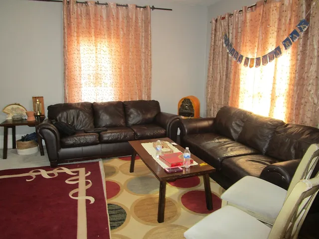 a living room with furniture and a window