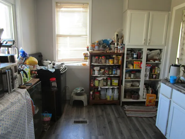 a room with furniture and a book shelf
