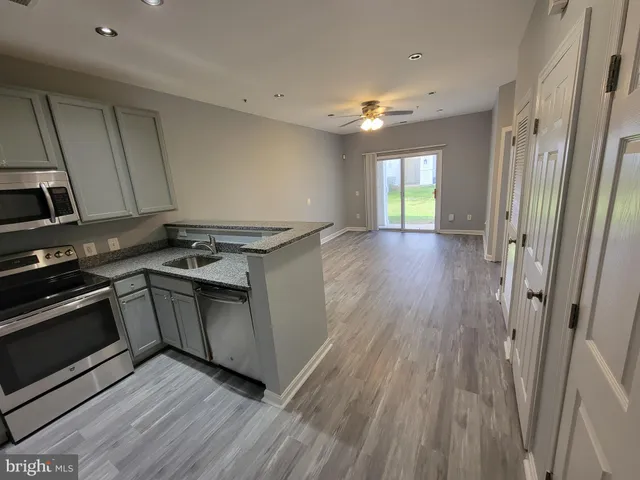 a view of a kitchen with electric appliances