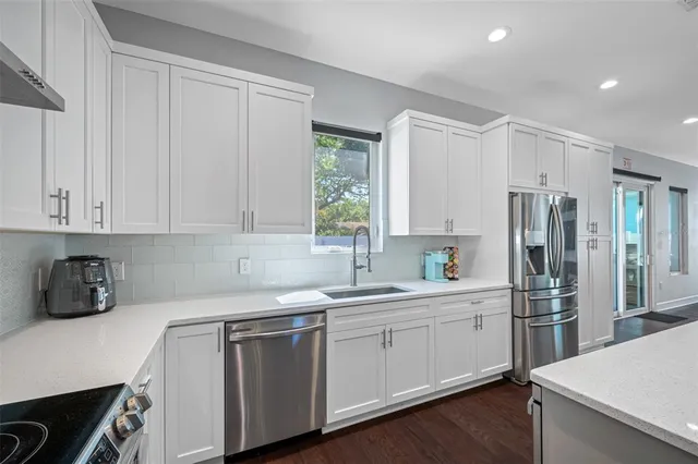 a bedroom with a bed and painting on the wall