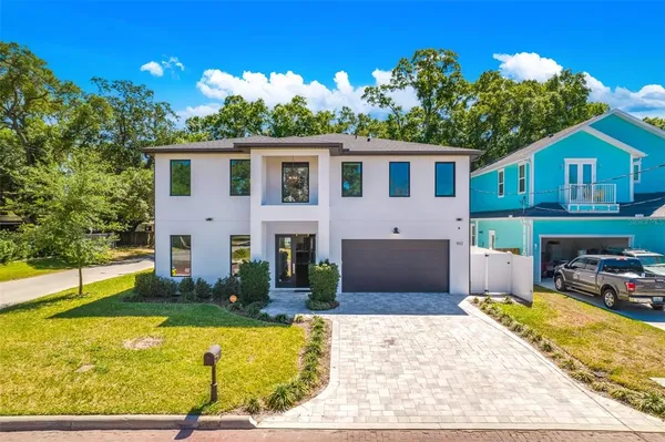 a living room with kitchen island furniture and a wooden floor