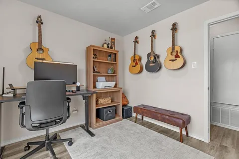 a bedroom with a bed and a couch