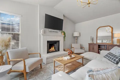 a kitchen with kitchen island a refrigerator stove and microwave