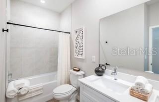 5900 Southwest 112th Pl Road Ocala, FL 34476 - Photo 13 of 17 a bathroom with a sink toilet and shower