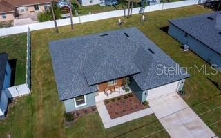 5900 Southwest 112th Pl Road Ocala, FL 34476 - Photo 16 of 17 an aerial view of a house with a yard