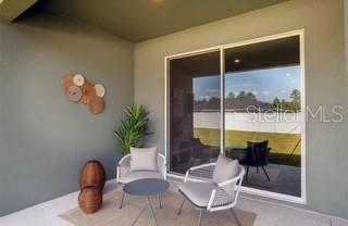 5900 Southwest 112th Pl Road Ocala, FL 34476 - Photo 10 of 17 a living room with furniture and a potted plant
