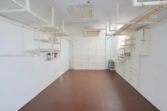 a view of a utility room with racks on the wall