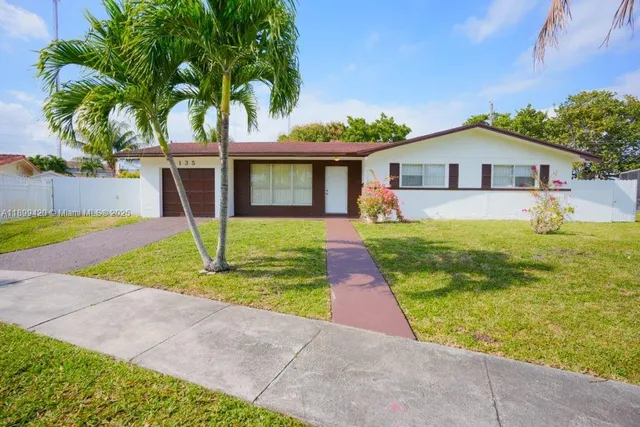 a view of an empty room with an outdoor view and a window