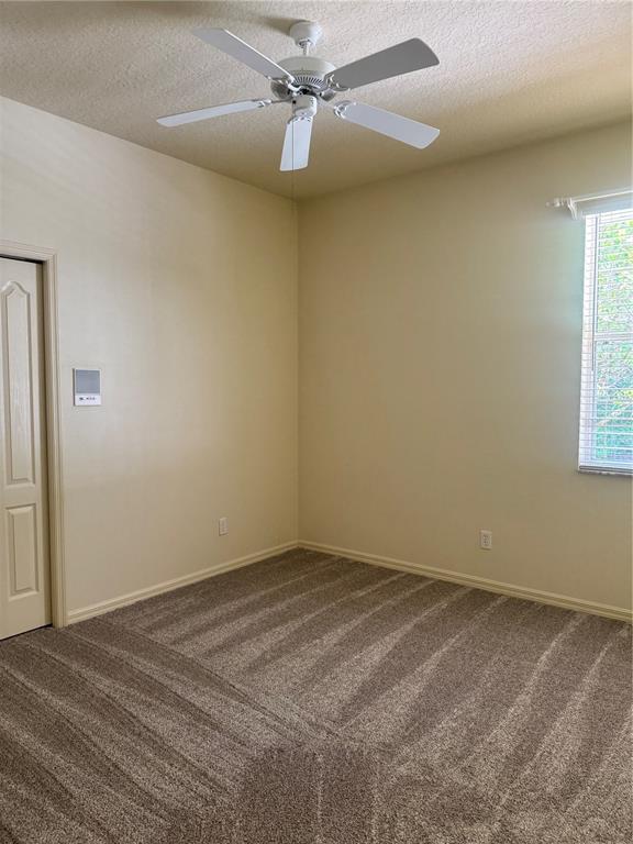 11145 Northwest 17th Court Road Ocala, FL 34475 - Photo 38 of 59 an empty room with windows and fan