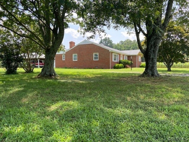 11370 Hanover Courthouse Road Hanover, VA 23069 - Photo 3 of 37 a house with huge green field in front of it