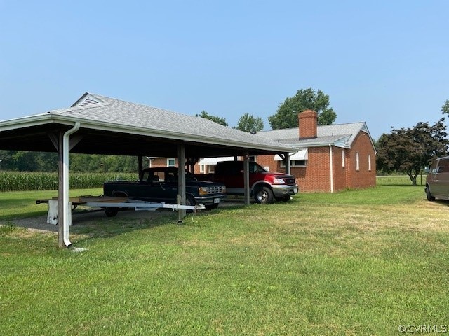 11370 Hanover Courthouse Road Hanover, VA 23069 - Photo 7 of 37 a view of a big yard with table and chairs under an umbrella