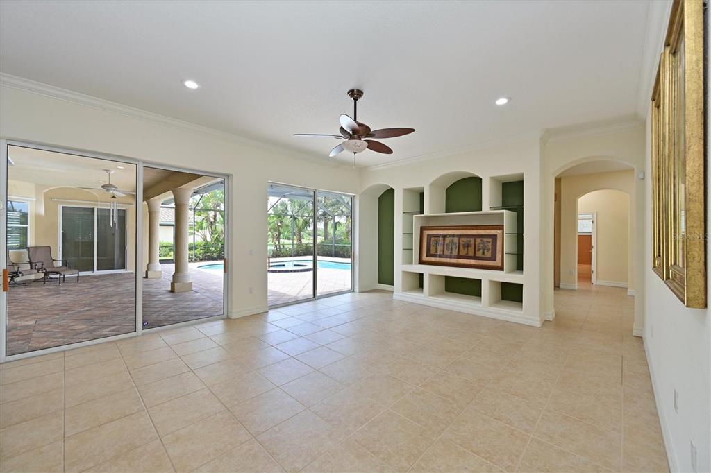 10622 Conch Shell Terrace Bradenton, FL 34212 - Photo 13 of 69 a view of livingroom with furniture ceiling fan and window