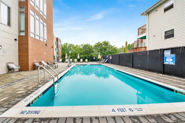 a view of a swimming pool with a chair