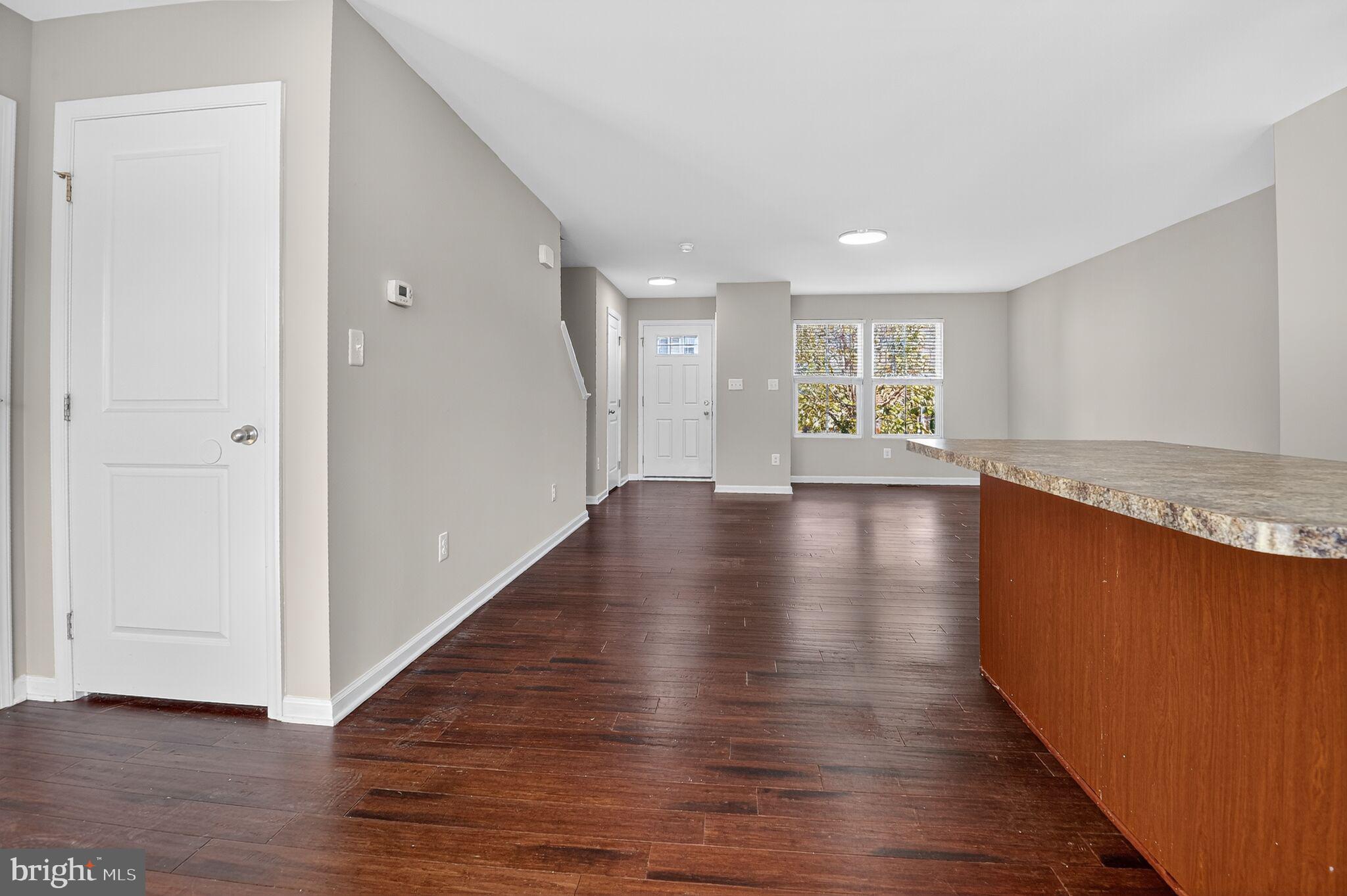 2012 Crepe Myrtle Lane Culpeper, VA 22701 - Photo 12 of 30 a view of an empty room with wooden floor and a window