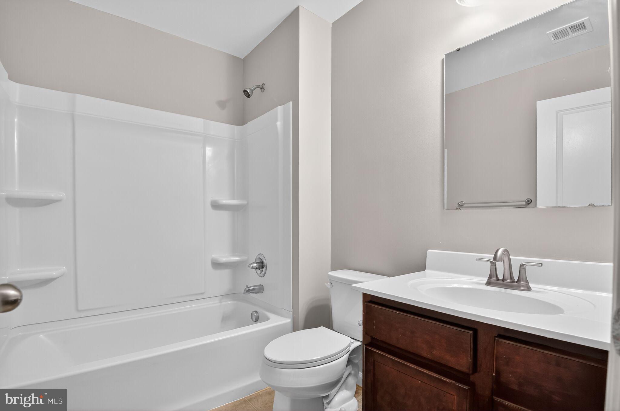 2012 Crepe Myrtle Lane Culpeper, VA 22701 - Photo 25 of 30 a bathroom with a sink a toilet and shower