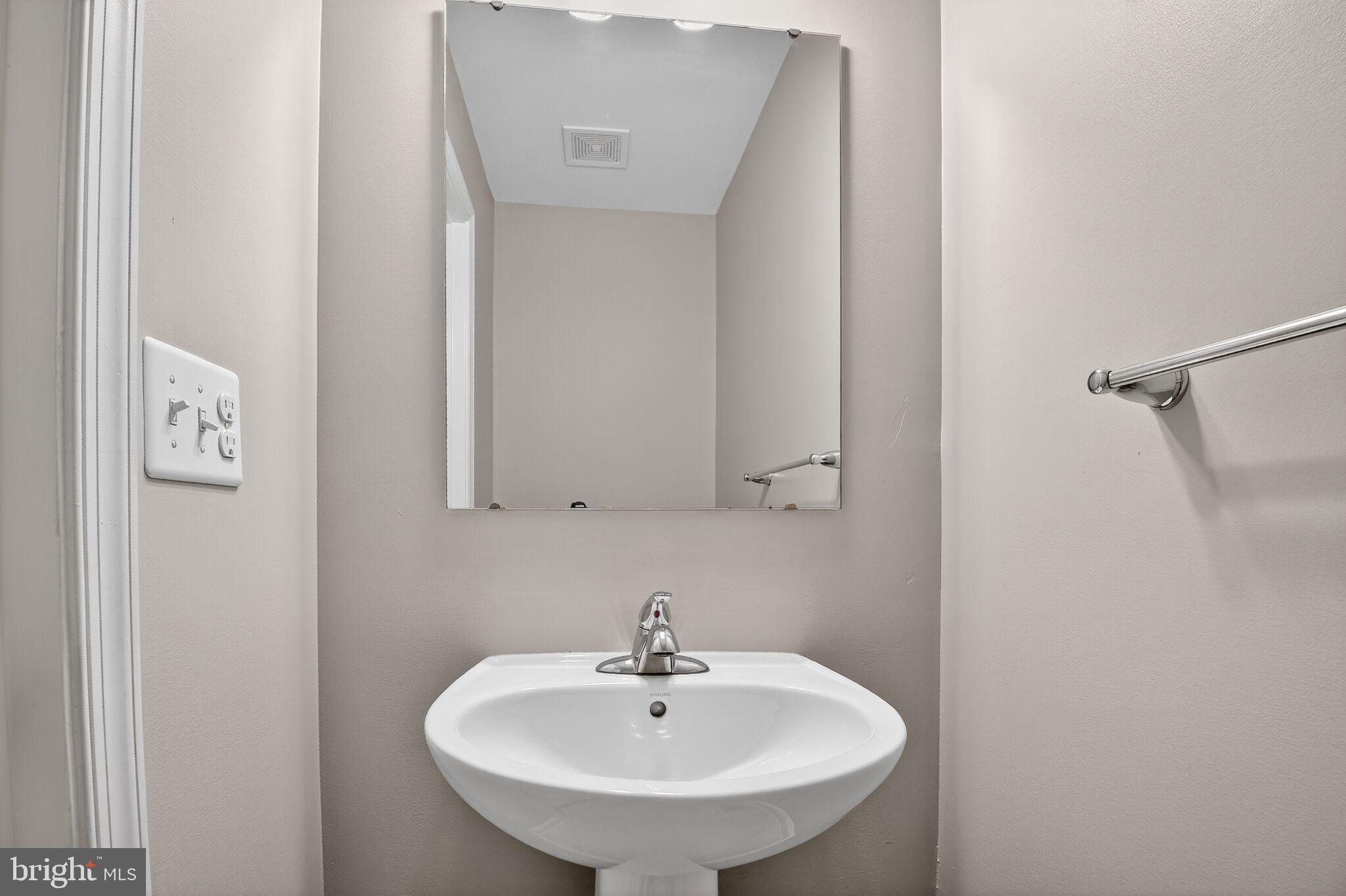 2012 Crepe Myrtle Lane Culpeper, VA 22701 - Photo 5 of 30 a bathroom with a sink and a mirror