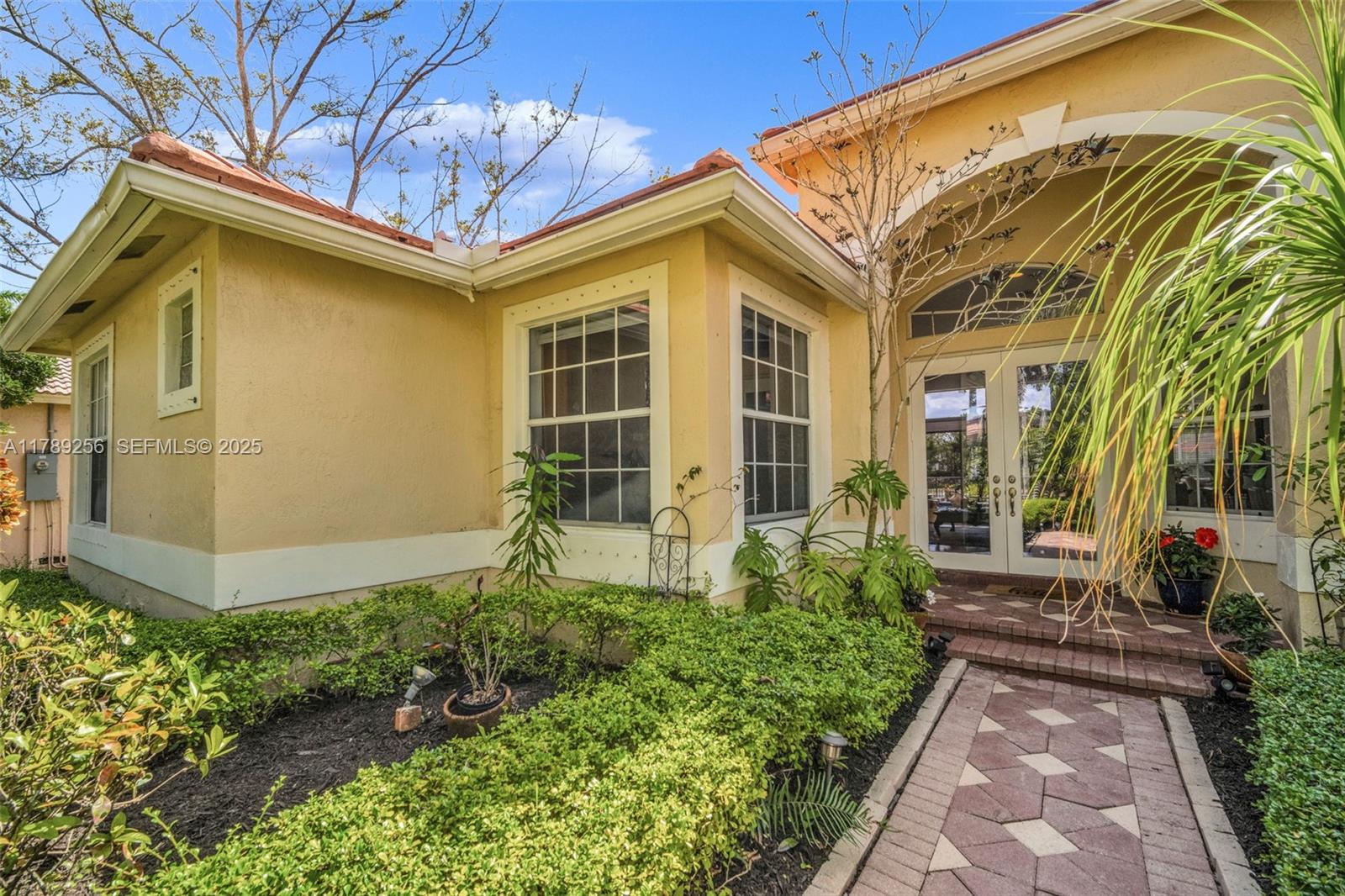 3739 Oak Ridge Circle Weston, FL 33331 - Photo 12 of 71 a house view with a garden space