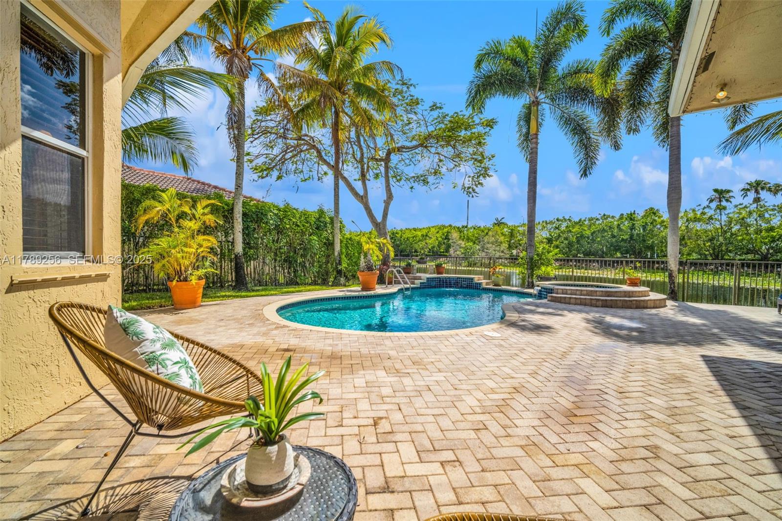 3739 Oak Ridge Circle Weston, FL 33331 - Photo 13 of 71 a view of a swimming pool with a patio