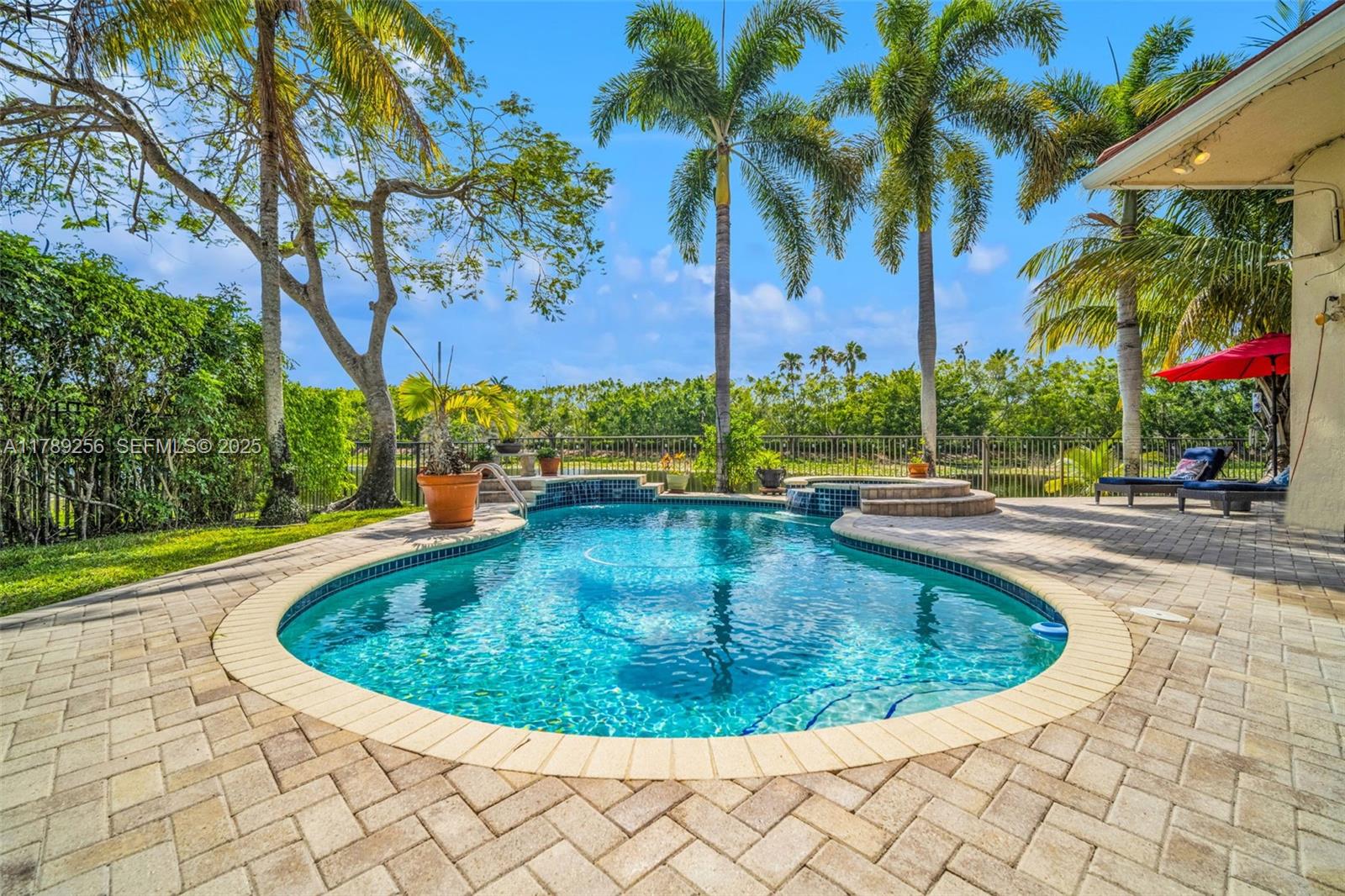 3739 Oak Ridge Circle Weston, FL 33331 - Photo 14 of 71 a view of outdoor space yard and swimming pool