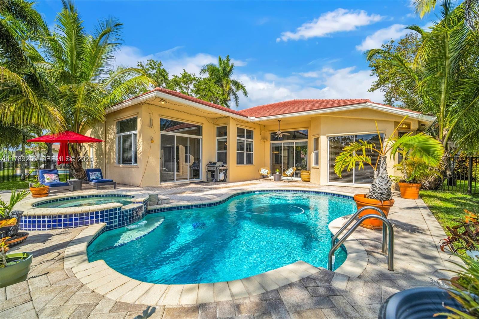 3739 Oak Ridge Circle Weston, FL 33331 - Photo 17 of 71 a view of a house with swimming pool and sitting area