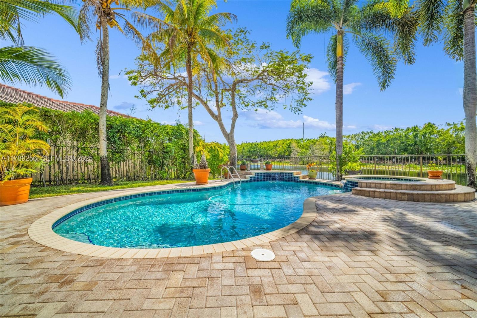 3739 Oak Ridge Circle Weston, FL 33331 - Photo 21 of 71 a view of a swimming pool with a yard