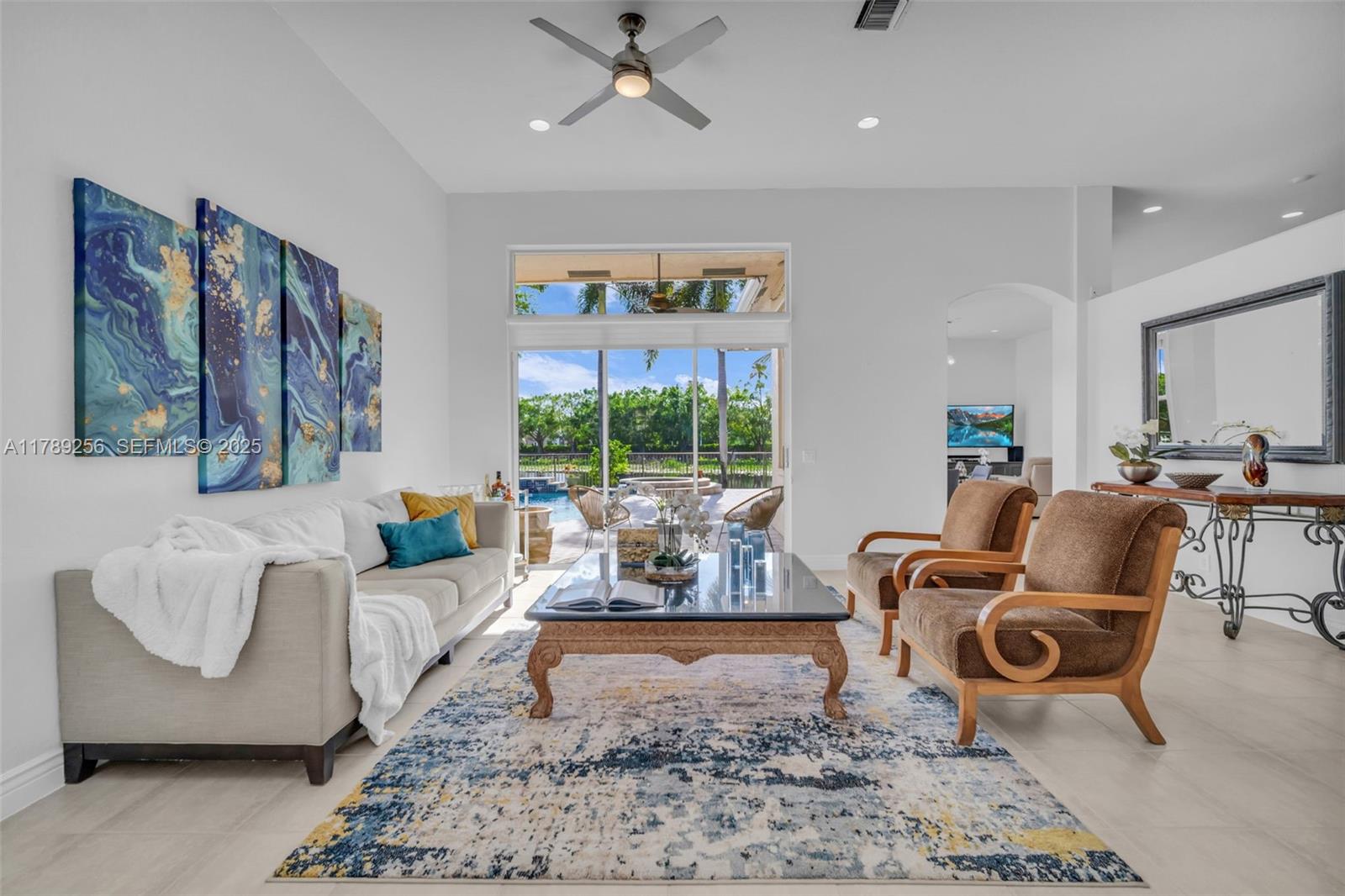 3739 Oak Ridge Circle Weston, FL 33331 - Photo 27 of 71 a living room with furniture and a large window