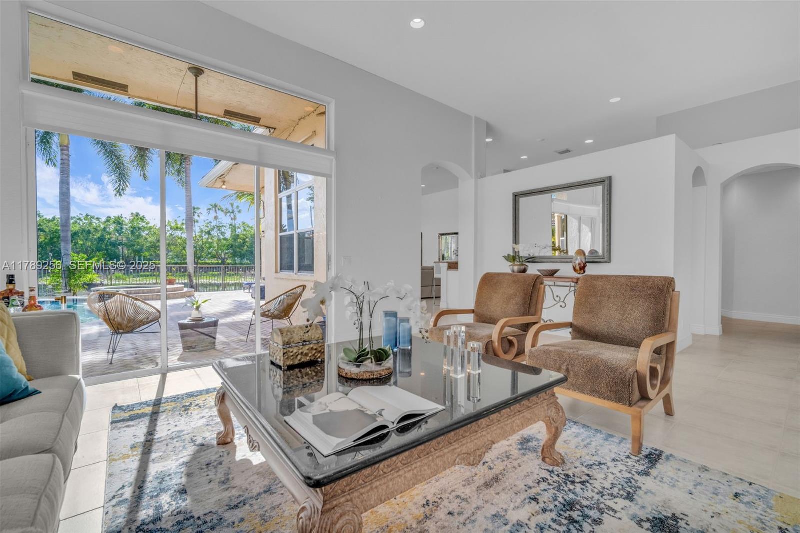 3739 Oak Ridge Circle Weston, FL 33331 - Photo 33 of 71 a living room with furniture and large windows