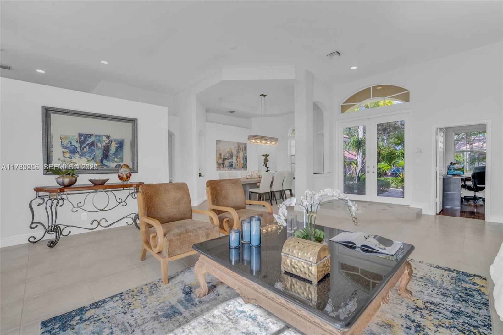 3739 Oak Ridge Circle Weston, FL 33331 - Photo 39 of 71 a living room with furniture and painting on the wall