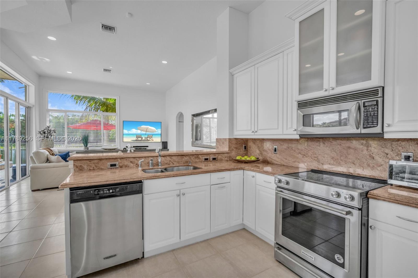 3739 Oak Ridge Circle Weston, FL 33331 - Photo 42 of 71 a kitchen with stainless steel appliances granite countertop a stove and cabinets