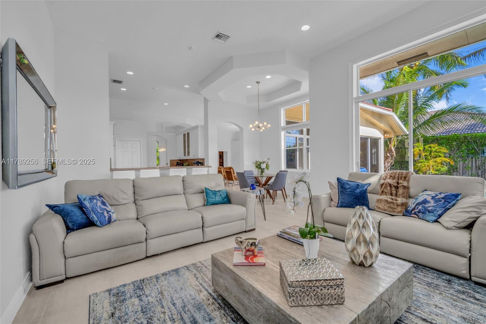 3739 Oak Ridge Circle Weston, FL 33331 - Photo 47 of 71 a living room with furniture and a couch