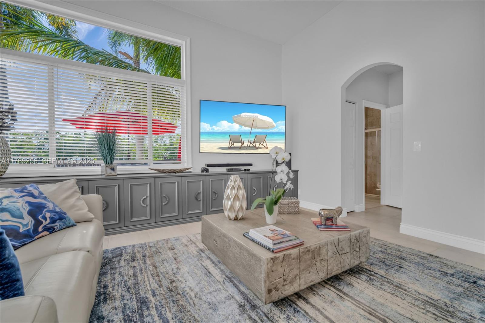 3739 Oak Ridge Circle Weston, FL 33331 - Photo 48 of 71 a living room with furniture and a flat screen tv