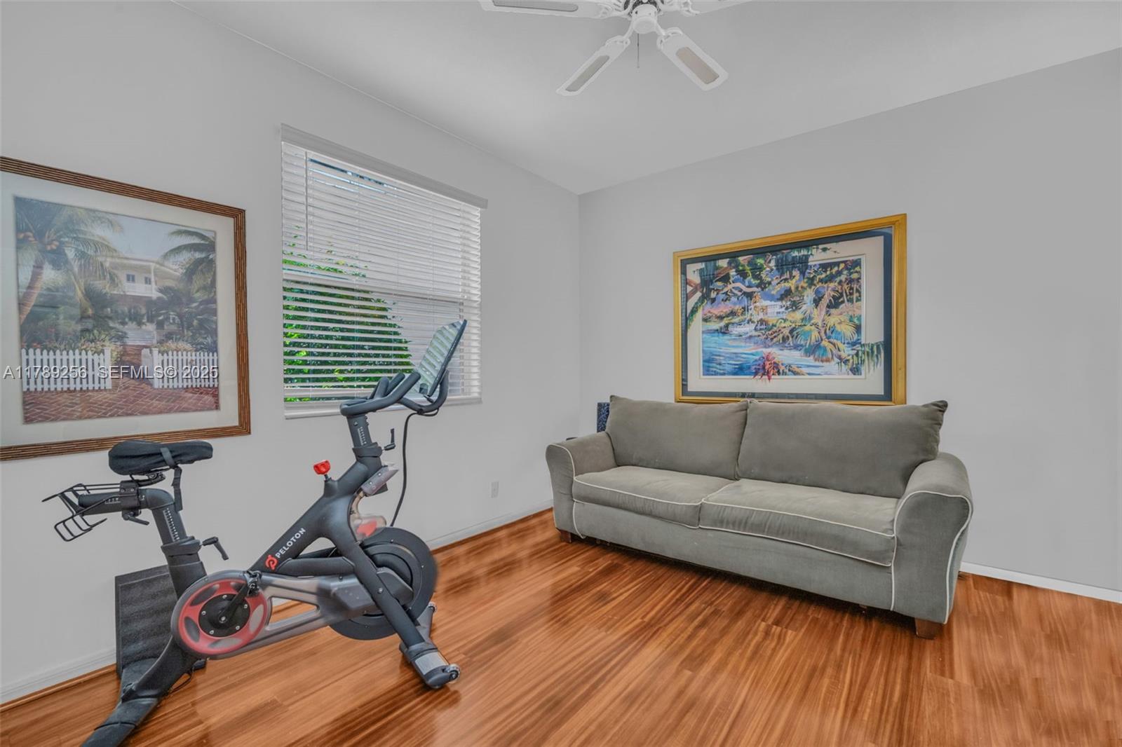 3739 Oak Ridge Circle Weston, FL 33331 - Photo 50 of 71 a living room with furniture a two large window and wooden floor