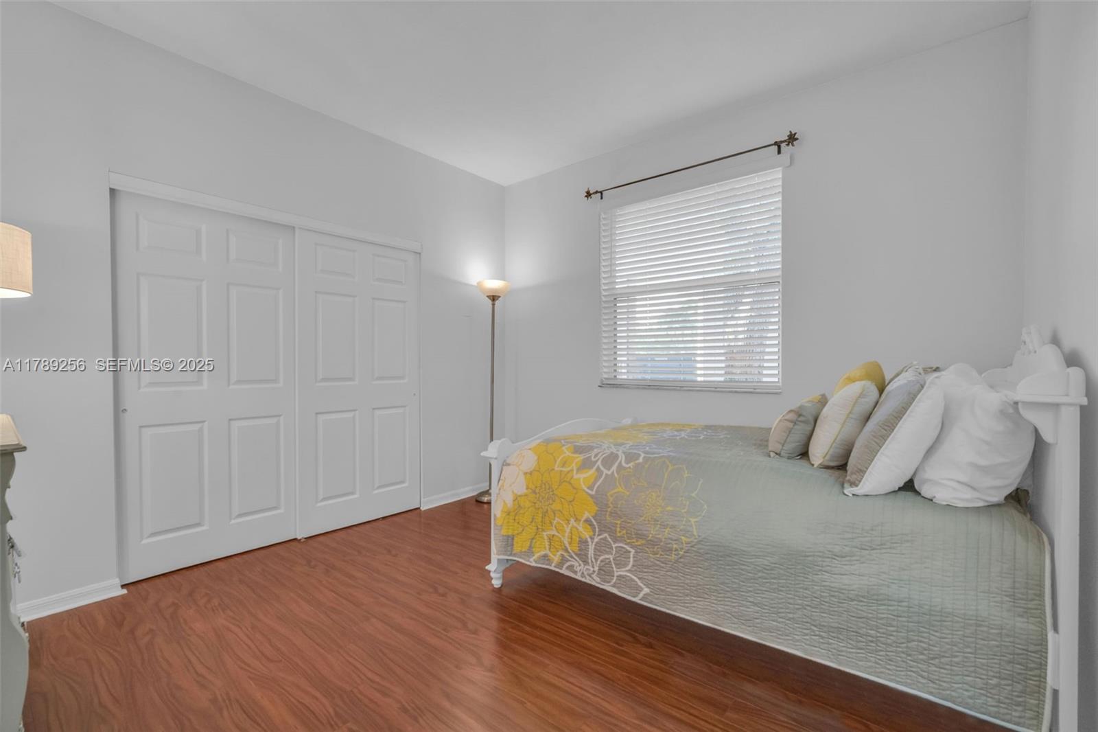 3739 Oak Ridge Circle Weston, FL 33331 - Photo 57 of 71 a bedroom with a bed and a window