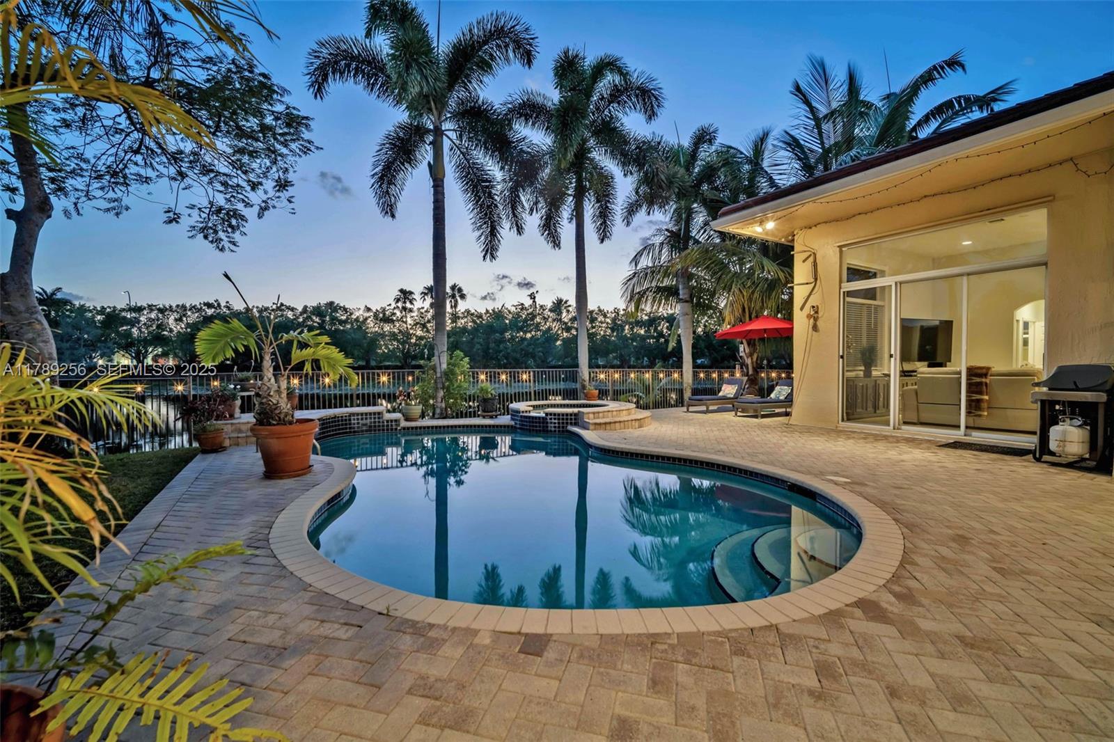 3739 Oak Ridge Circle Weston, FL 33331 - Photo 9 of 71 a view of a swimming pool with chairs