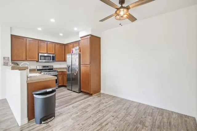 a kitchen with a refrigerator stove and a sink