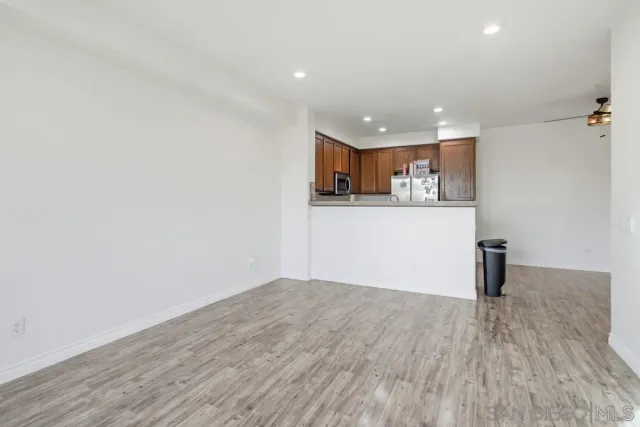 a view of a kitchen with wooden floor