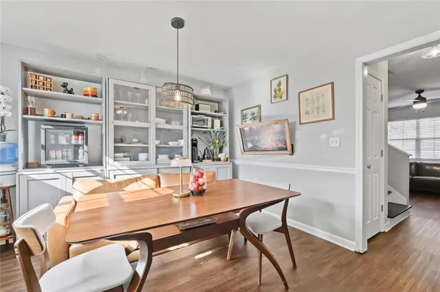 a view of a dining room with furniture window and wooden floor