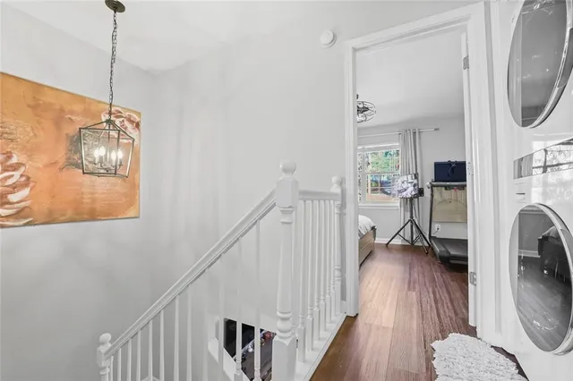 a view of a livingroom with furniture and hardwood floor