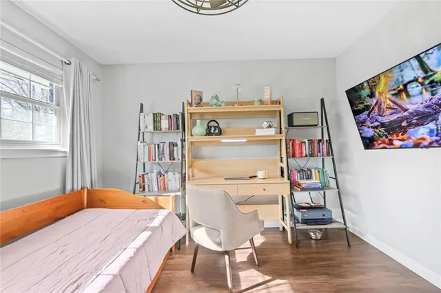 a room with a workspace and a window