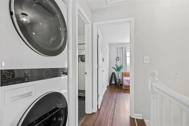 a view of a hallway with washer and dryer