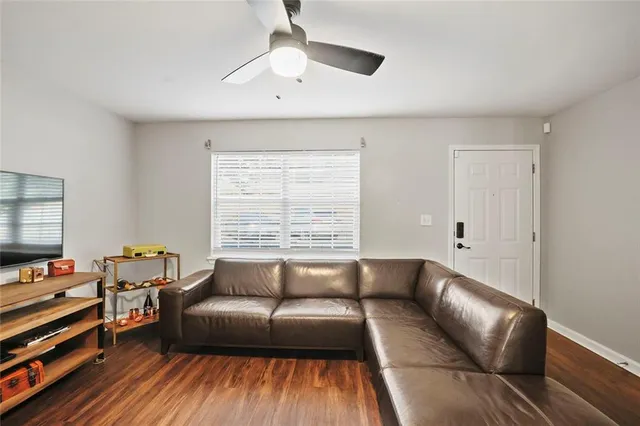 a living room with furniture and a window