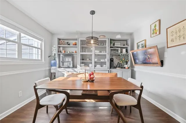 a view of a dining room with furniture window and wooden floor