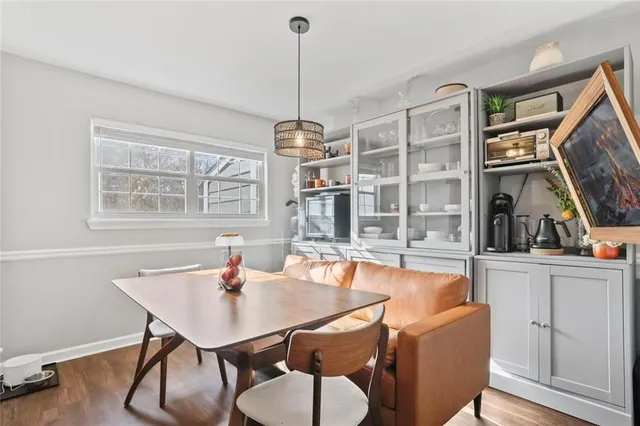 a view of a dining room with furniture window and wooden floor