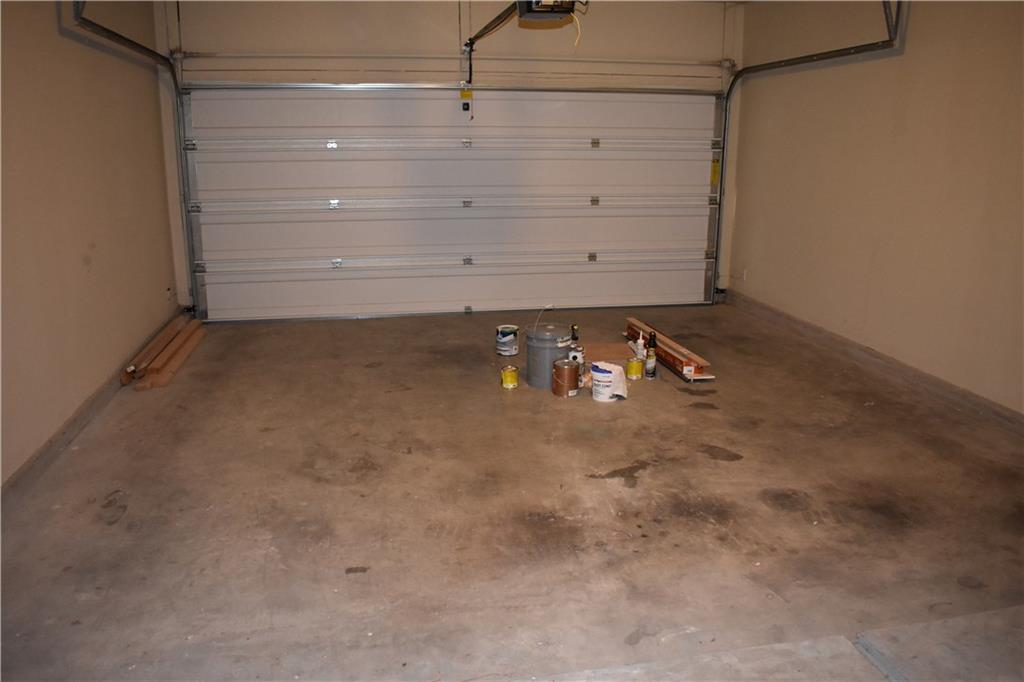 1310 West Parmer Lane, Unit 1503 Austin, TX 78727 - Photo 23 of 26 Garage with a garage door opener
