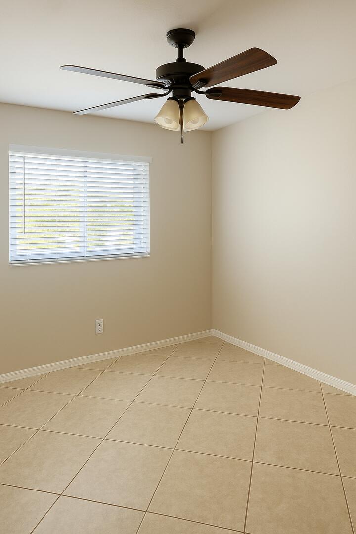 4670 Northeast 5th Avenue, Unit 1 Boca Raton, FL 33431 - Photo 5 of 8 a view of an empty room with a window